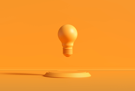 Orange light bulb symbolizing innovation at EKWB